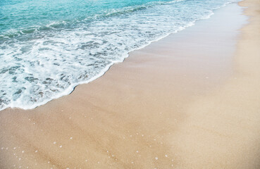 Wave of the sea on the sandy beach