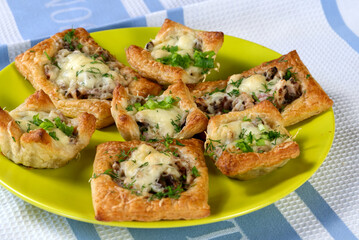beautiful homemade pies on a green ceramic plate. Pies close up