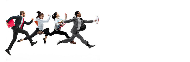 Four happy office workers jumping in casual clothes with folders on white studio background. Business concept.