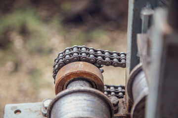 Metal chain on a mechanical pipe bender.