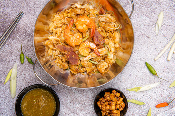 Kwetiau goreng medan or char kway teow It is made from noodles, which are stir fried in cooking oil with garlic, onion or shallots, pork, fried prawn, sliced bakso (meatballs) 