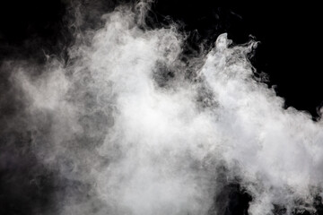 Fototapeta na wymiar White smoke on a black background. Texture