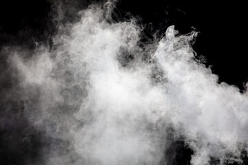 Fototapeta premium White smoke on a black background. Texture