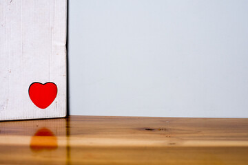 red heart on wooden background