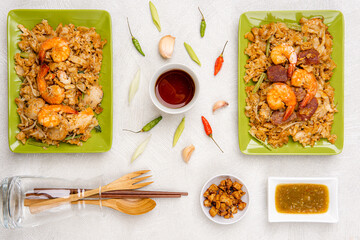 Kwetiau goreng medan or char kway teow It is made from noodles, which are stir fried in cooking oil with garlic, onion or shallots, pork, fried prawn, sliced bakso (meatballs) 