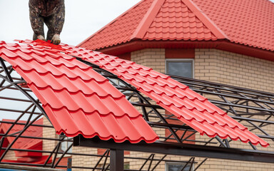 Workers are installing a metal canopy.
