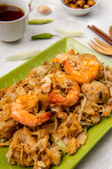 Kwetiau goreng medan or char kway teow It is made from noodles, which are stir fried in cooking oil with garlic, onion or shallots, pork, fried prawn, sliced bakso (meatballs) 