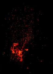 Sparks from fire on a black