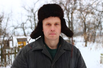 Poor young peasant in winter