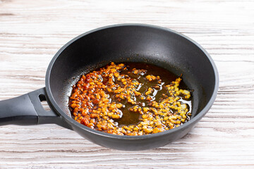 Onions and spices in a pan. Chicken kadhai. Indian chicken curry. Cooking step by step