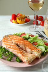 Concept of tasty eating with grilled salmon, close up