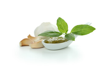 Spoon of Pesto sauce and ingredients isolated on white background