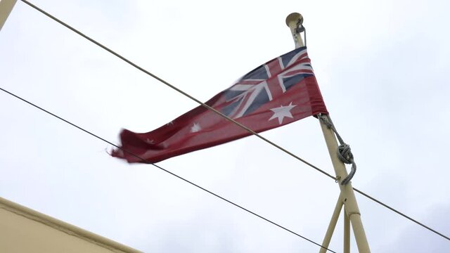 Close up footage of Australian Red Ensign Flag or Commonwealth Red Ensign Flag for Merchant Navy.