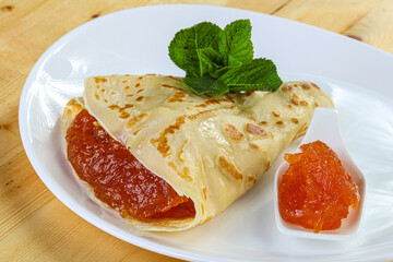 Delicous pancake with fruit jam