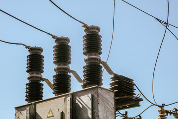 High voltage insulator garlands with electric wires on transformer station