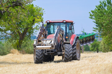 tractor in field - 437197006