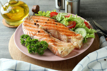 Concept of tasty eating with grilled salmon, close up