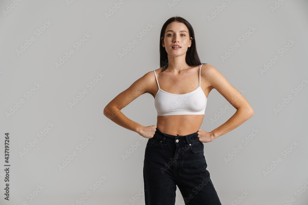 Wall mural Smiling young white woman with long brunette hair