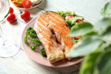 Concept of tasty eating with grilled salmon, close up