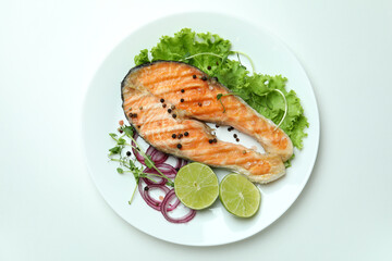 Concept of tasty eating with grilled salmon on white background