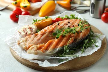 Concept of tasty eating with grilled salmon, close up