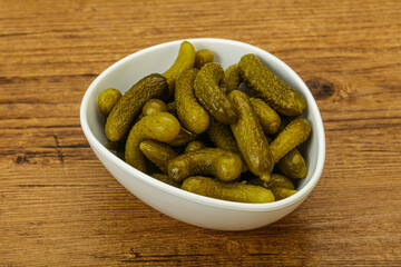 Pickled gherkin in the bowl