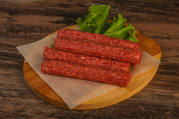 Raw beef sausages with spices