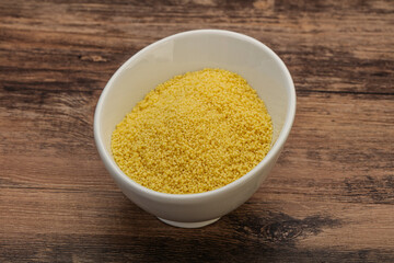 Raw cous cous heap in the bowl