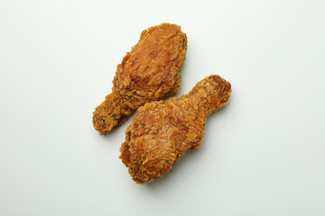 Tasty fried chicken on white background, close up