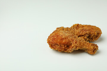 Tasty fried chicken on white background, close up