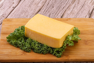 Tasty yelloow Tilsiter cheese brick