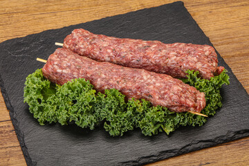 Raw minced beef kebab skewer