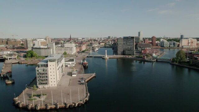 Drone getting closer to Malmö city centre, summer, aerial view
