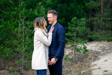 Happy loving couple enjoying of happiness love and tenderness, dating, romance.Couple hugging in love at spring park.