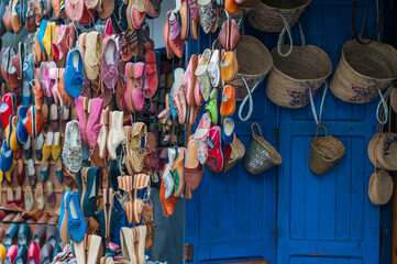 Oriental shoes / Colorful shoes hang in front of a market stall in a souk.