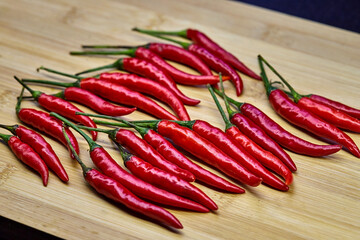 close-up view red chili peppers on cutting board