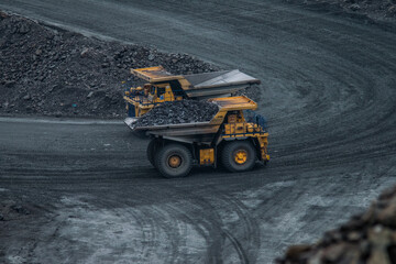 Two quarry dumper trucks on the road  © Artemiyf