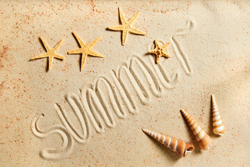 Summer inscription on a sandy background, decorated with starfish and exotic seashells