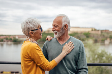 Mature couple, reminiscing about their life together.