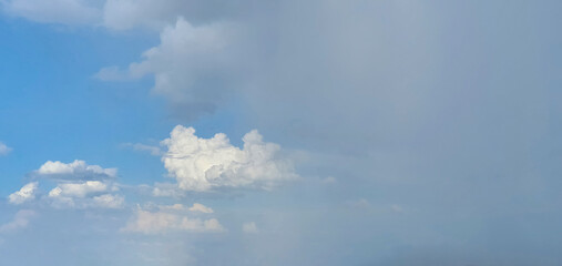 Cloudy dark color sky at sunset after summer rain. Space for text.