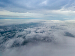 High view of the Dnieper River in Kiev. Aerial high flight above the clouds.
