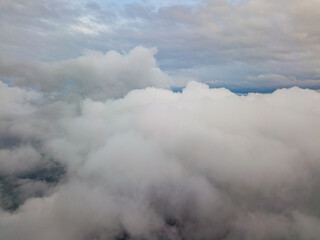 Aerial high flight above the clouds.