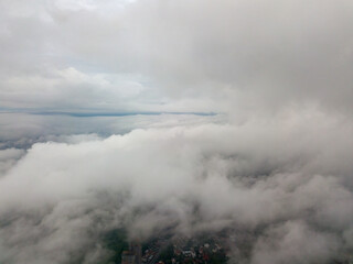 Aerial high flight above the clouds.