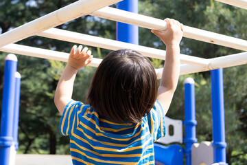 Fototapeta premium little child playing on playground