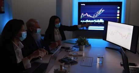 Business woman explaining trading strategies inside bank meeting room while wearing safety face mask - Investment and financial concept - Powered by Adobe