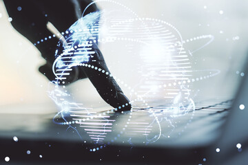 Abstract graphic digital world map with connections and hands typing on computer keyboard on...