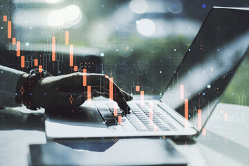 Creative concept of crisis chart illustration with hands typing on laptop on background. Global...