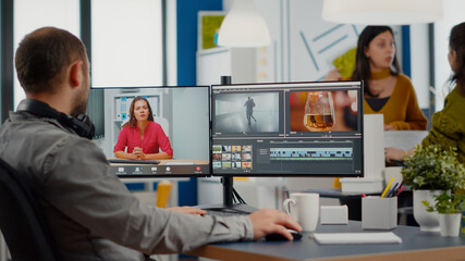 Videographer in web online conference with project manager on video call editing client work,...