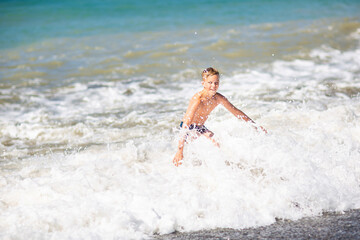 boy by the sea in a storm