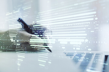 Abstract creative world map and hand writing in notebook on background with laptop, international trading concept. Multiexposure